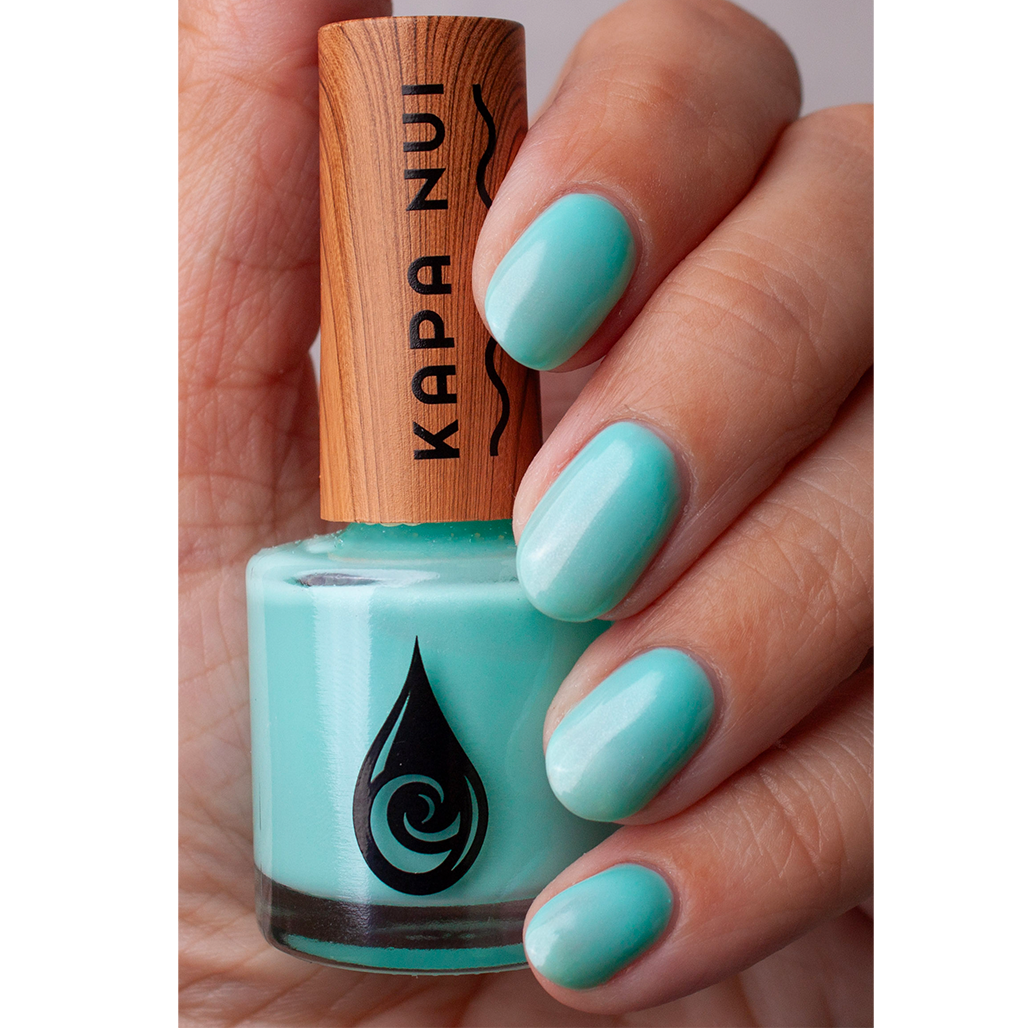 non toxic nail polish blue jade hand swatch with bottle