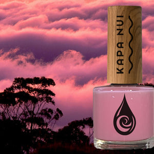 non toxic nail polish bottle next to pink misty sky