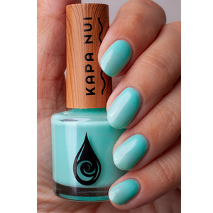 water based nail polish blue jade hand swatch with bottle