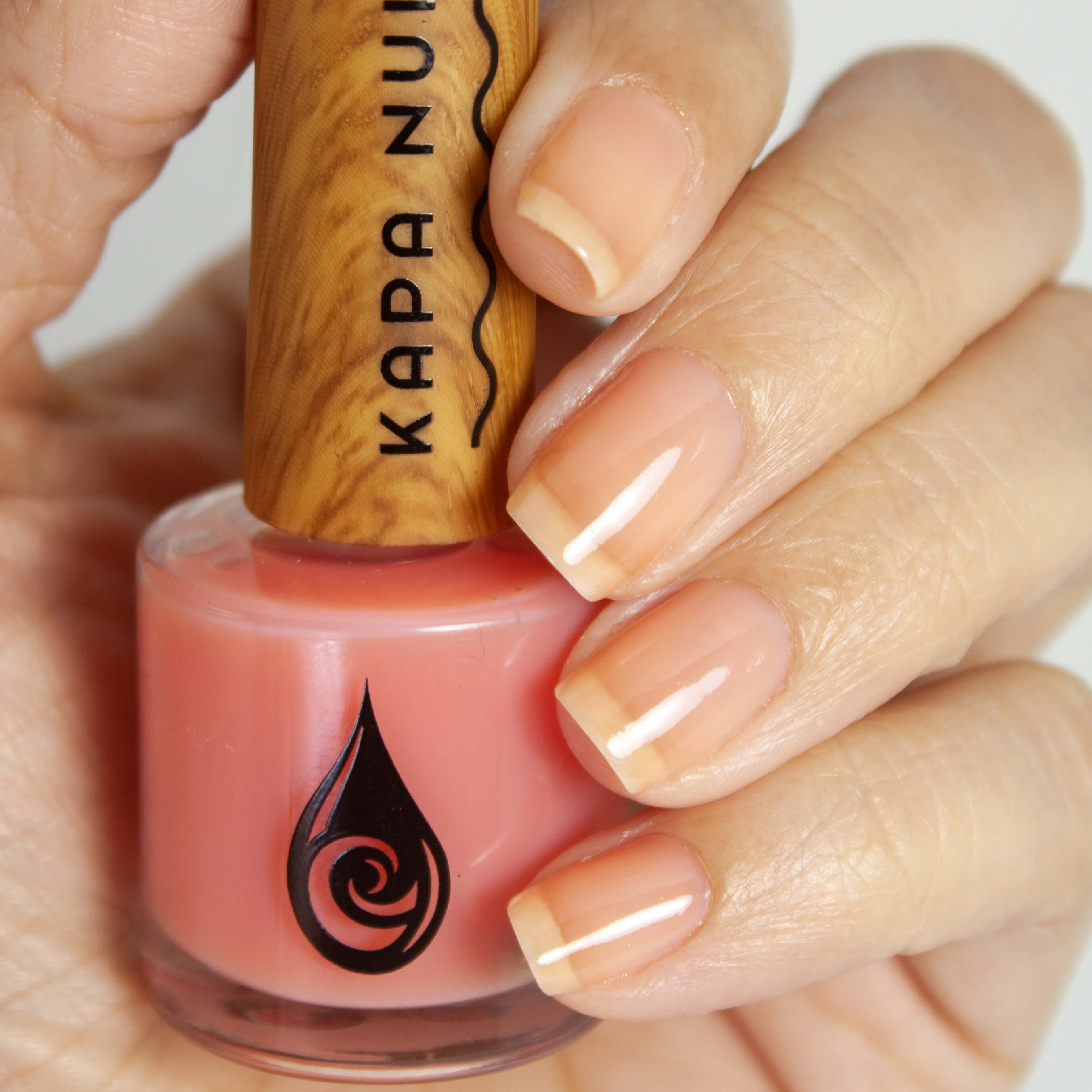 piki non toxic nail polish bottle inside hand model