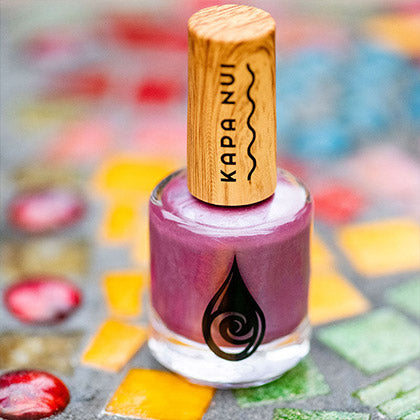 evening orchid non toxic nail polish bottle sitting on mosaic tiles