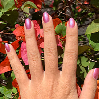 hand with painted nails of evening orchid nail polish
