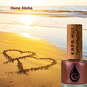 hana aloha non toxic nail polish bottle next to beach scene