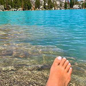 hinahina non toxic nail polish painted toes on the water