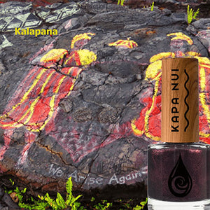kalapana non toxic nail polish bottle next to lava rocks at kalapana