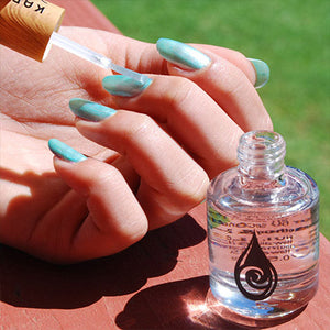 women putting on kapa nui base and top coat sealer on top of kapoho dreams 100% toxin free nail polish