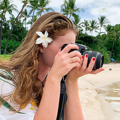women taking a picture with camera wearing lehua blossom water based nail polish