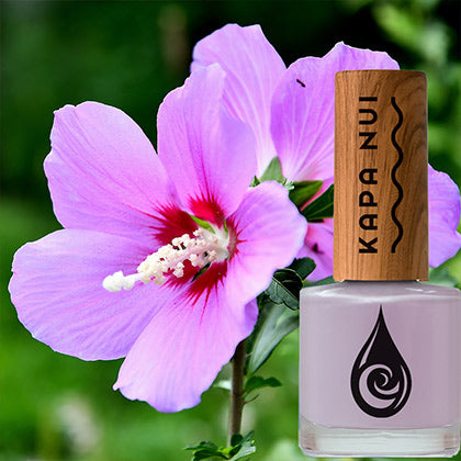 little poni non toxic nail polish bottle next to purple hibiscus