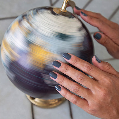 manta ray non toxic nail polish hands holding globe
