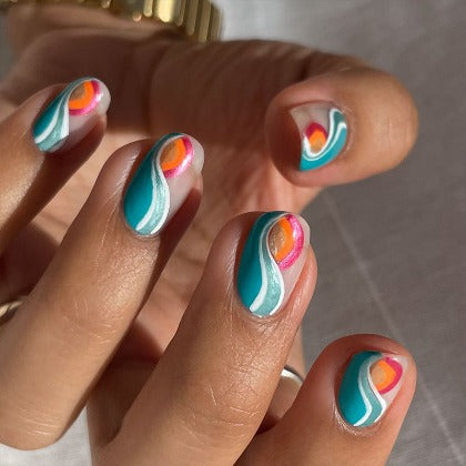 hand with nail art using anini beach non toxic nail polish