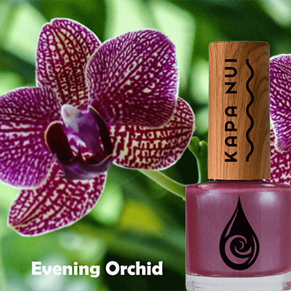 g orchid non toxic nail polish bottle next to evening orchid flower