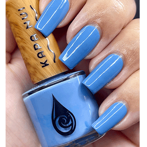 ahina non toxic nail polish hand swatch holding bottle