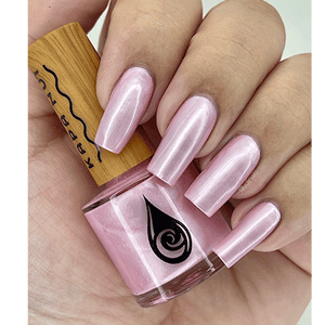 hand with nails polished in seashells heart kapa nui nail polish
