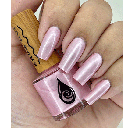 hand with nails polished in seashells heart kapa nui nail polish