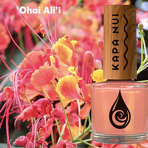non toxic nail polish in ohai color next to flowers