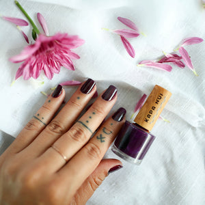 popolo berry non toxic nail polish on womans hands