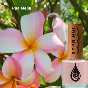 pua  melia non toxic nail polish next to plumeria flowers