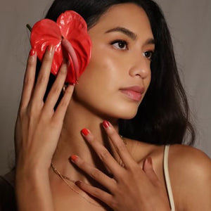 women wearing kapa nui nail polish on her hands