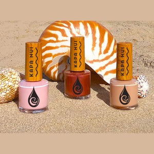 seashell collection on the beach with nail polish colors